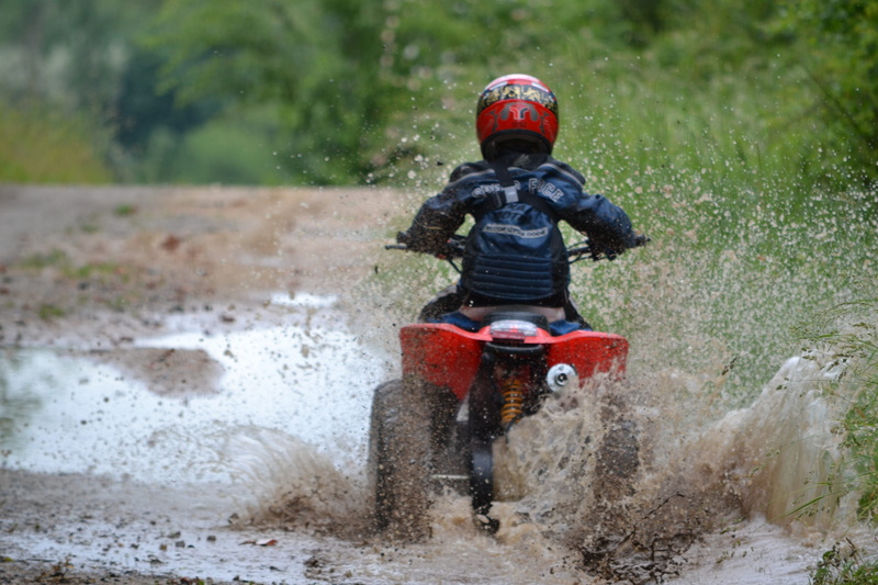 joy, puddle, rear view, nature, water, Quad, day, show, sports race, action, outdoors, one person, happy, sport, wet, Child, riding, mode of transportation