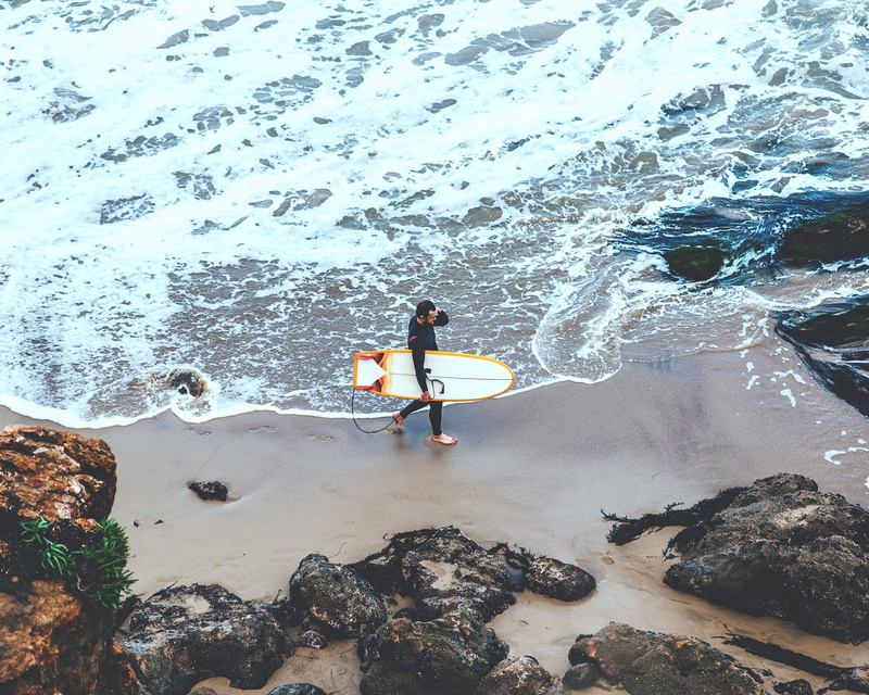 land, outdoors, water, lifestyles, real people, sea, full length, foam, one person, surfing, day, ocean, sand, rock - object, surf, 2K, holding, guy, walking