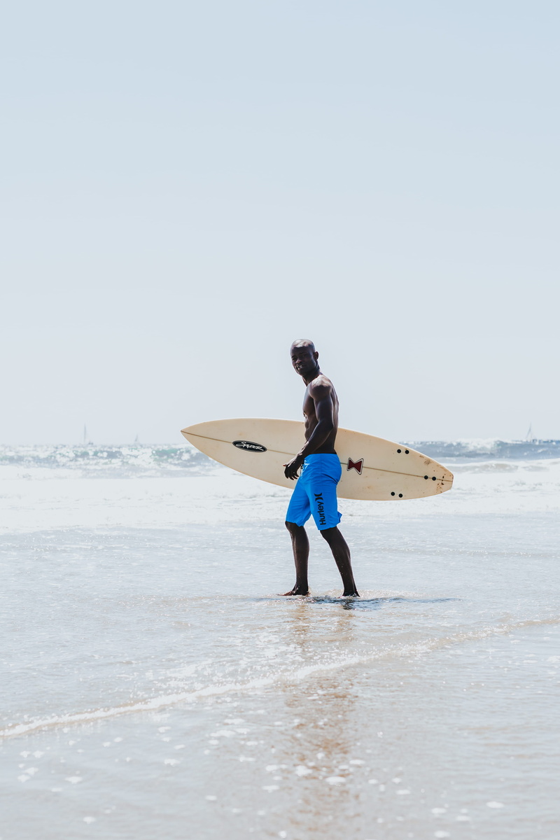 african american, wave, nature, beach, outdoors, short, candid, real people, ocean, land, shoreline, lifestyles, walking, carrying, sky, sea, seashore