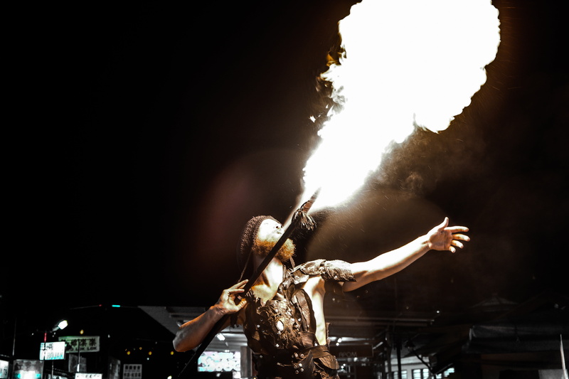 illuminated, man, breathing, body part, young adult, arts culture and entertainment, flames, display, spear, crafts, light, limb, adult, black background