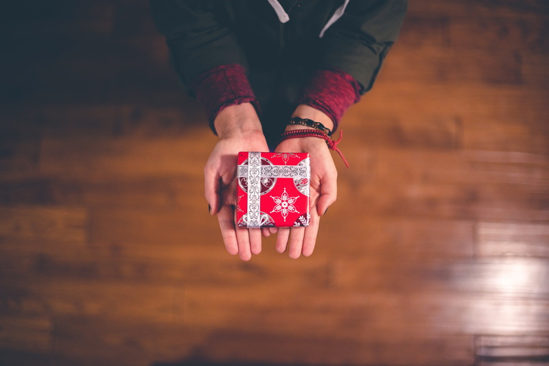 holiday, giving, s, holding, human limb, wood - material, focus on foreground, people, wooden, close-up, one person, one man only, floor, white, gambling