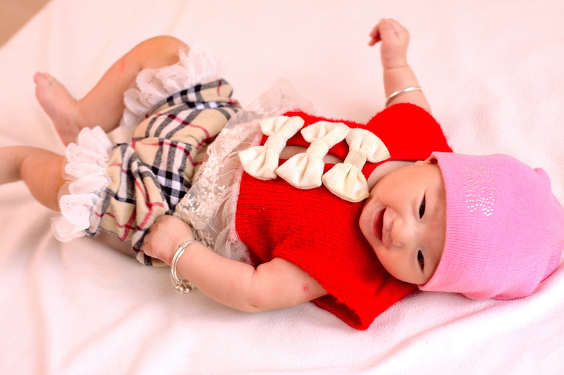Child Care, child, people, lying on back, indoors, beauty, innocence, bed, happiness, childhood, red, beautiful, young, one Person, lifestyle, lifestyles