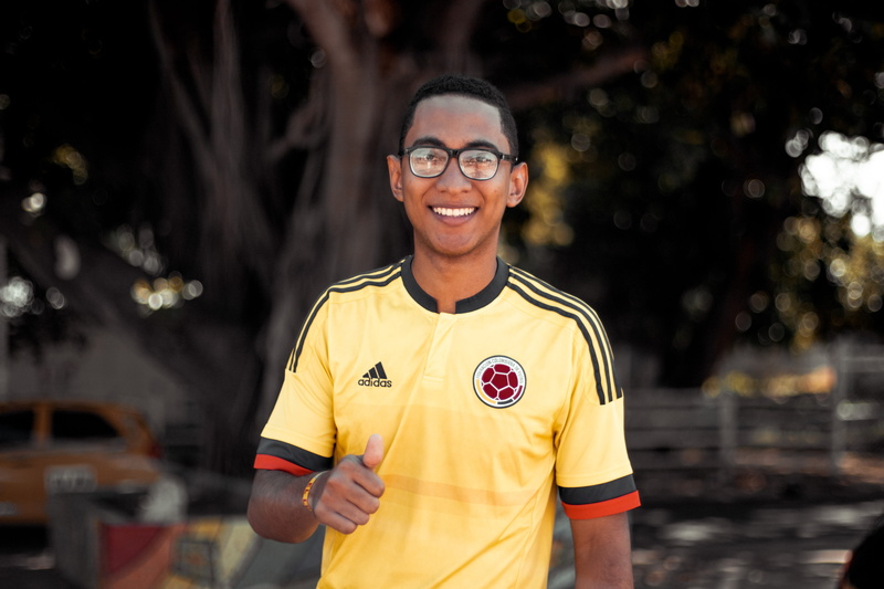 adidas, front view, emotion, waist up, young men, wearing, championship, festival, thumbs up, black, player, sport, jersey, focus on foreground, looking at camera