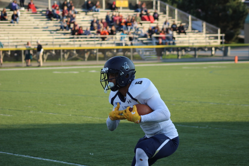 outdoors, blurred background, teenager, clothing, outfit, sports equipment, competition, helmet, playing, action, american football field, uniform, adolescence