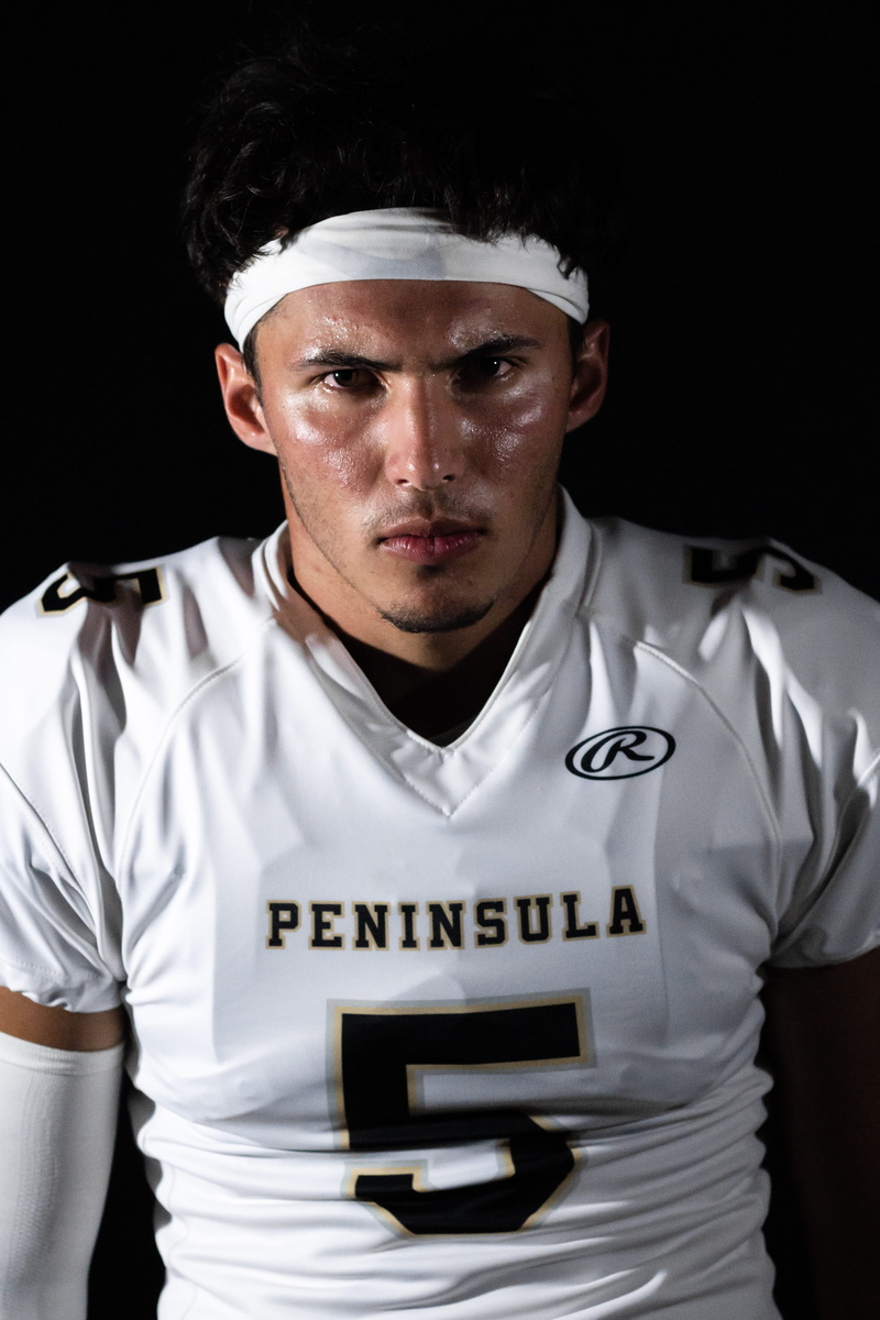indoors, looking at camera, oil, people, finger, front view, hat, portrait, football, worker, young men, men, jersey, apparel, adult, face, man, sleeve