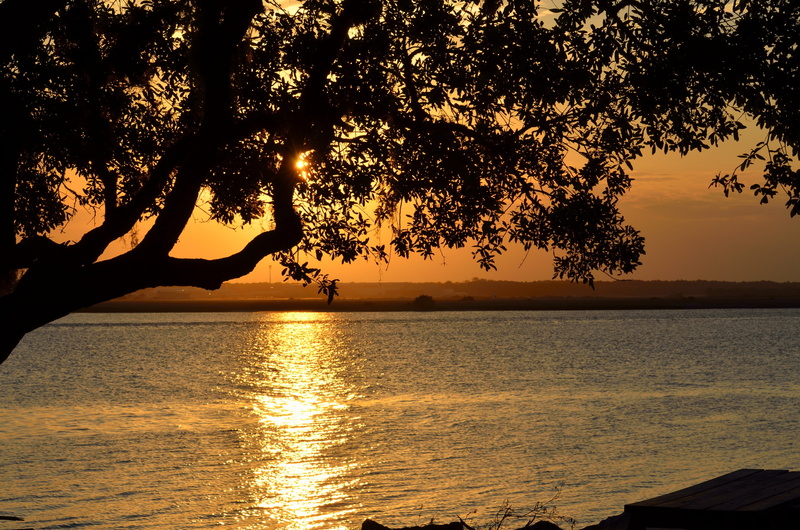 sunlight, no people, water, silhouette, sky, sun, clouds, orange color, dusk, beauty in nature, evening, tranquil scene, sunset, tranquility, summer, tropical climate