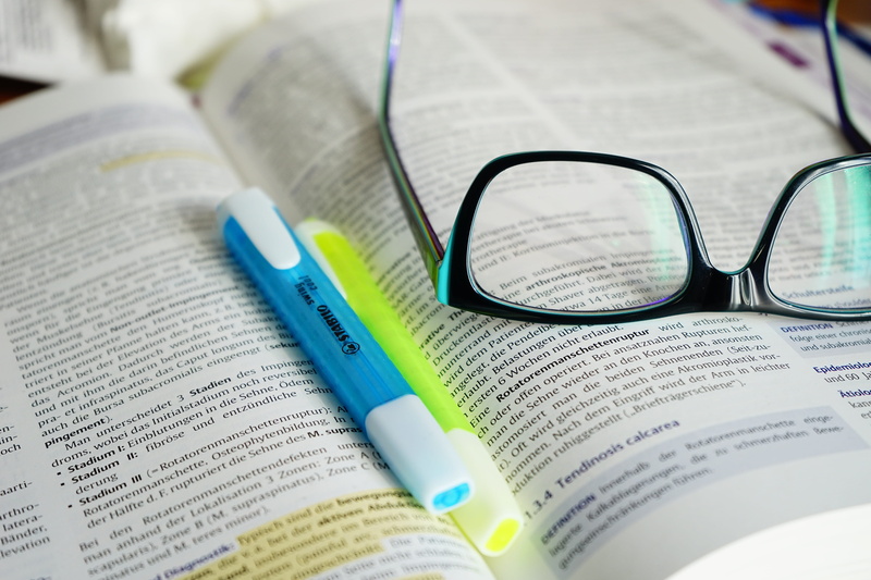 newspaper, text, paper, high angle view, still life, studying, book, communication, table, personal accessory, page, pen, no people, education, 5K, look up