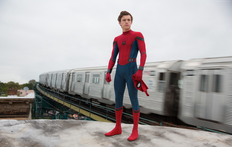 transportation, young adult, beautiful woman, track, superhero, real people, one person, railroad track, best movies, lifestyles, looking at camera, Spider-man homecoming