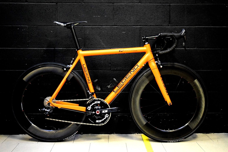 no people, close-up, carbon fiber, parking, tire, bicycle, city, road, transportation, travel, black color, garage, day, outdoors, mode of transportation