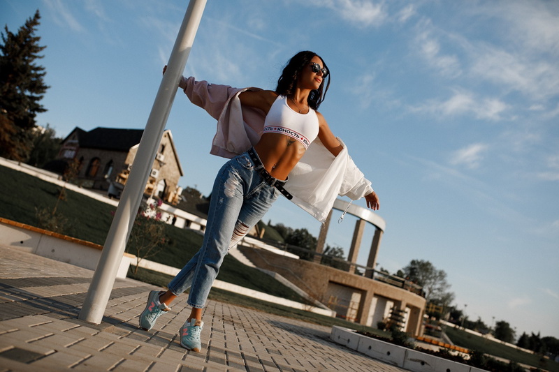 belly, pierced navel, brunette, portrait, jacket, belt, sneakers, women, white tops, women with shades, bokeh, outdoors, tattoo, sky, depth of field, model