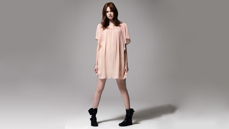 hairstyle, beauty, black, boots, one person, Karen Gillan, beautiful woman, indoors, standing, human limb, adult, shoe, mini skirt, gray, full length, fashion