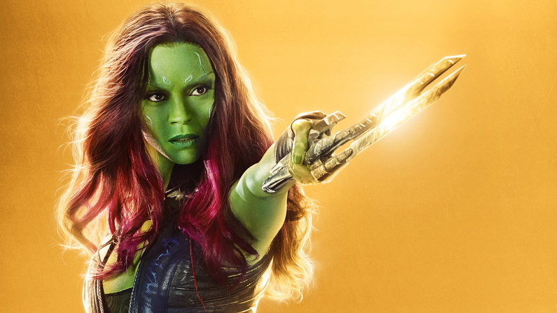 Zoe, adult, studio shot, looking at camera, long hair, one person, teenager, young adult, holding, green color, yellow, casual clothing, Gamora, colored background
