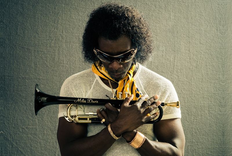 Best Movies of 2016, hairstyle, 2K, one person, glasses, wall - building feature, young adult, front view, sitting, musical instrument, playing, portrait