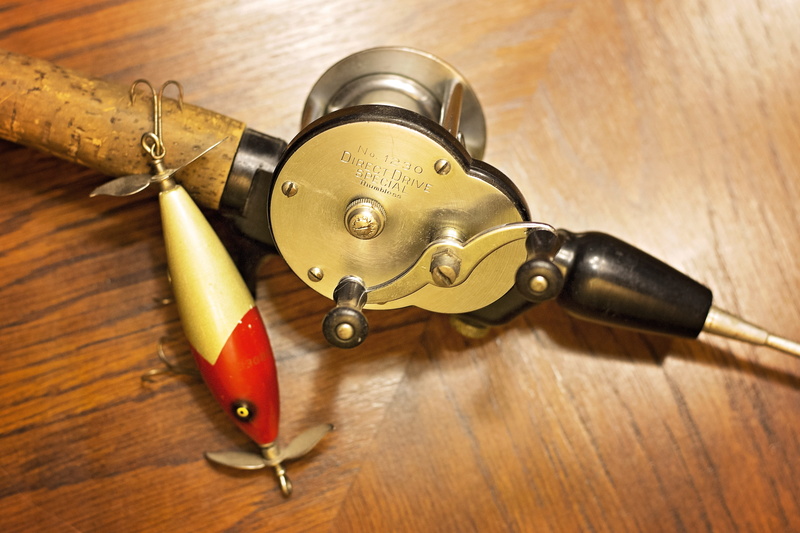 fishing pole, fish, 5K, bait, fishing reel, still life, metal, antique, creativity, corkscrew, simplicity, wood - material, wood, indoors, business, equipment