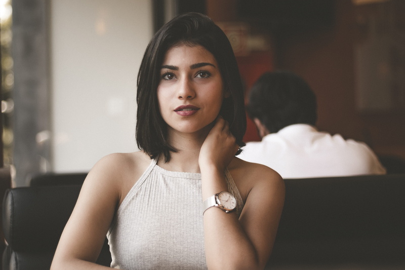 contemplation, young women, adult, young adult, shirt, sitting, top, photo, wearing, halter, front view, one person, leather, female, beautiful people