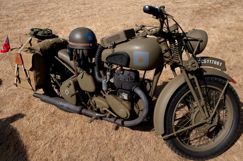 security, motorcycle, land vehicle, travel, stationary, no people, British motorcycle, helmet, land, coloring, sunlight, transportation, technology, bicycle