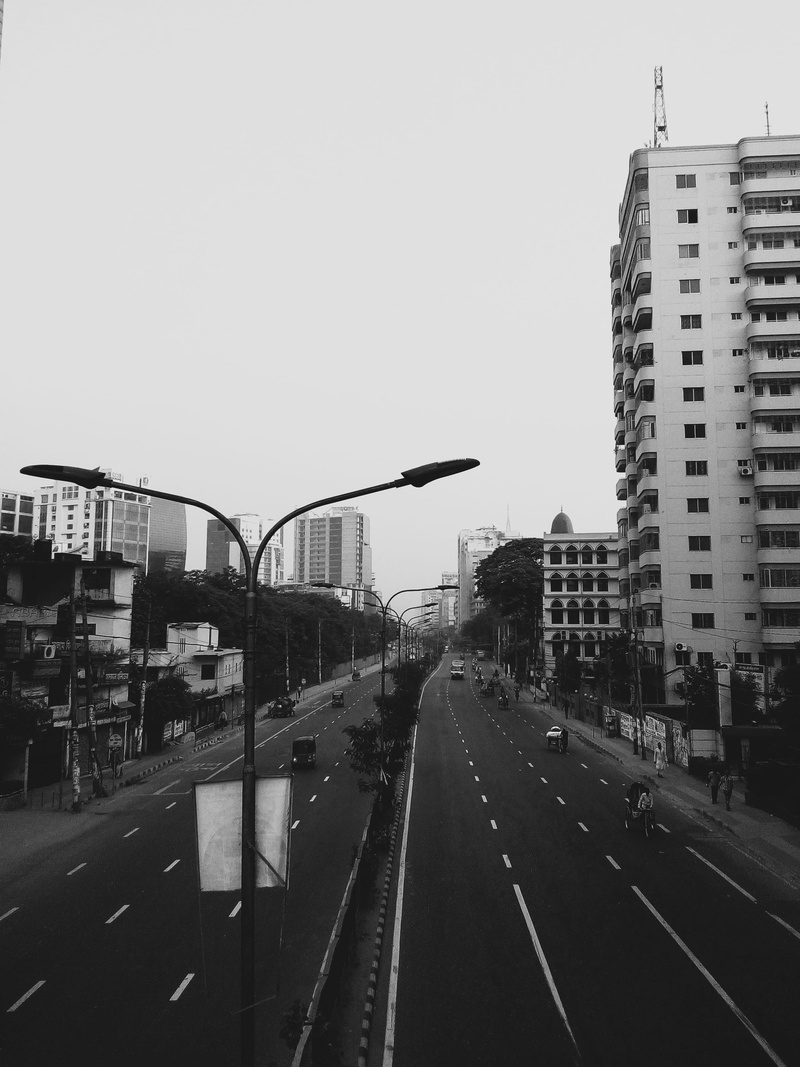 mode of transportation, cityscape, transportation, built structure, sky, city, road, nature, building, asphalt, road marking, car, no people, clear sky