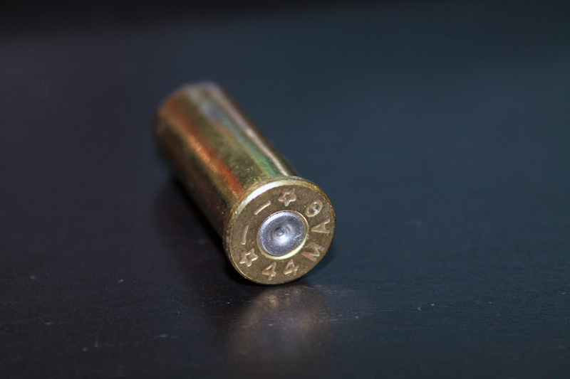 silver colored, table, no people, colored background, social issues, bullet, selective focus, shape, ammo, connection, 44 magnum, magnum, close-up, metal