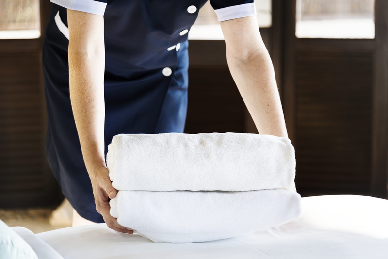real people, towels, focus on foreground, worker, pillows, resort, uniform, white, chef, front view, holding, staff, wear, food and drink, healthcare, working