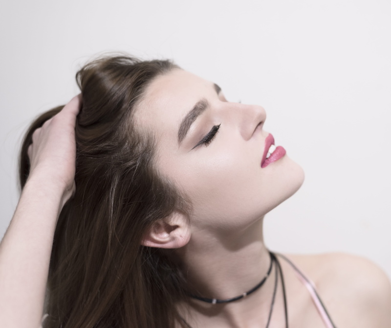 woman, hairstyle, headshot, eyes closed, sideways, wheel, apparel, person, clothing, indoors, 5K, human face, beauty, contemplation, mouth, one person