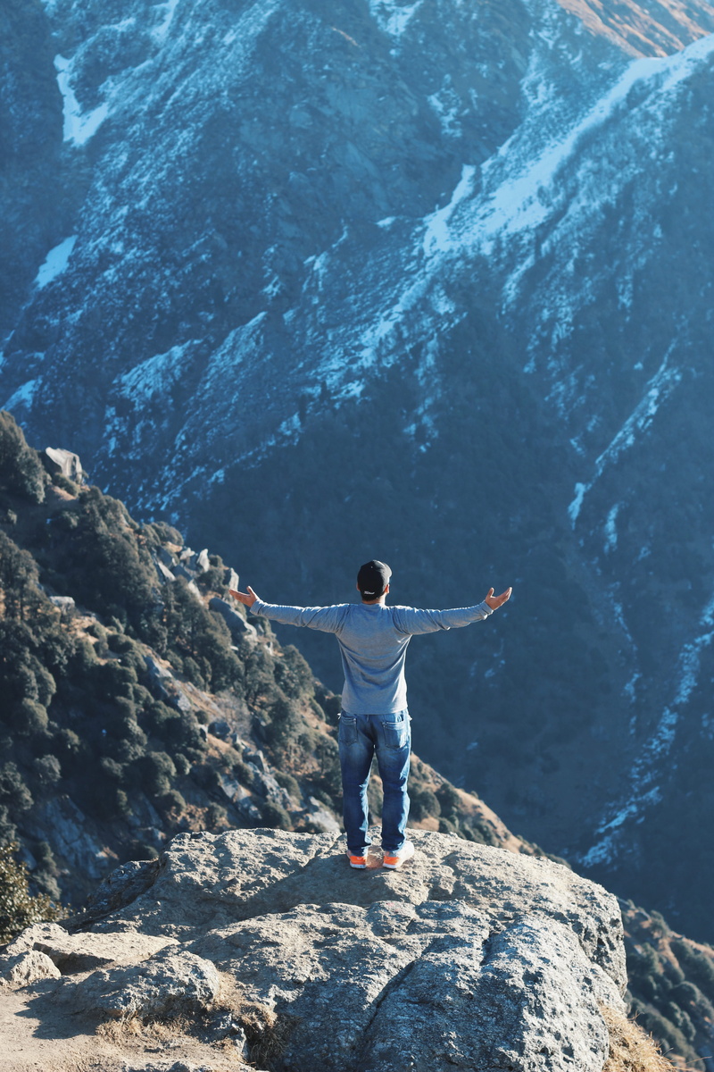 5K, beauty in nature, top, rock, one person, leisure activity, man, limb, human limb, sideways, hand, spreading, mountain, outdoors, arms outstretched