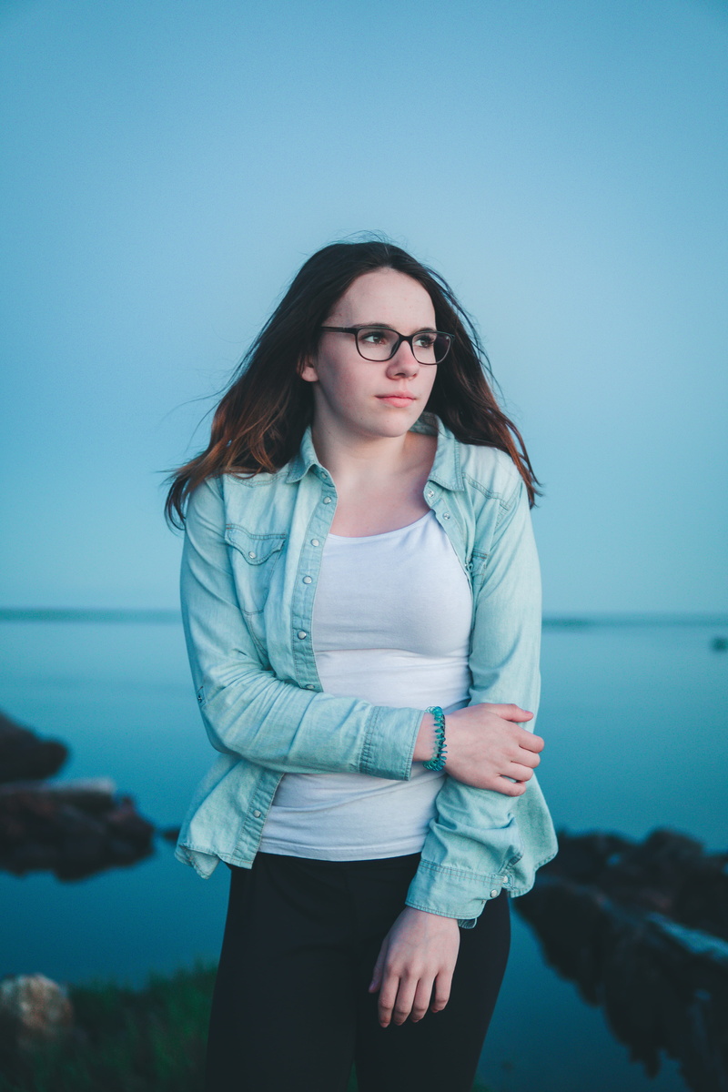 dark, lifestyles, looking away, female, front view, three quarter length, beautiful woman, water, hairstyle, forearm, women, long hair, casual clothing
