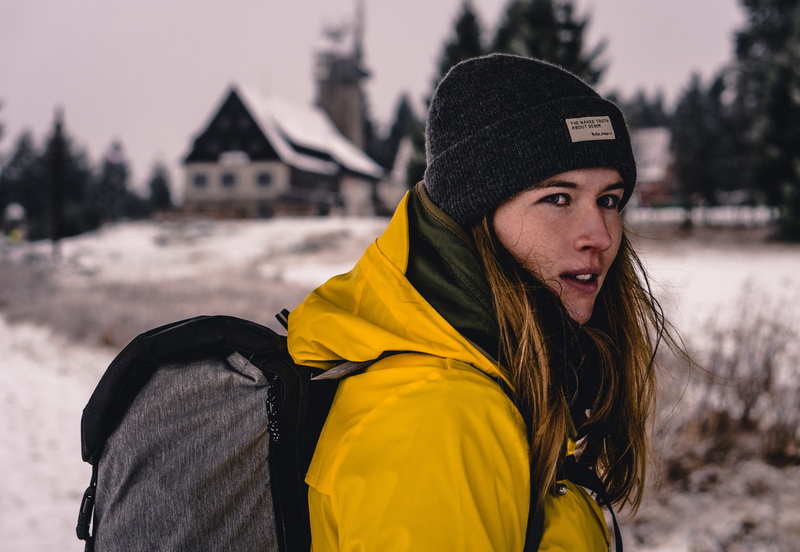 standing, hat, selective, one person, snow, female, outdoors, photography, girl, backpack, warm clothing, winter, coat, lifestyles, jacket, scarf, yellow