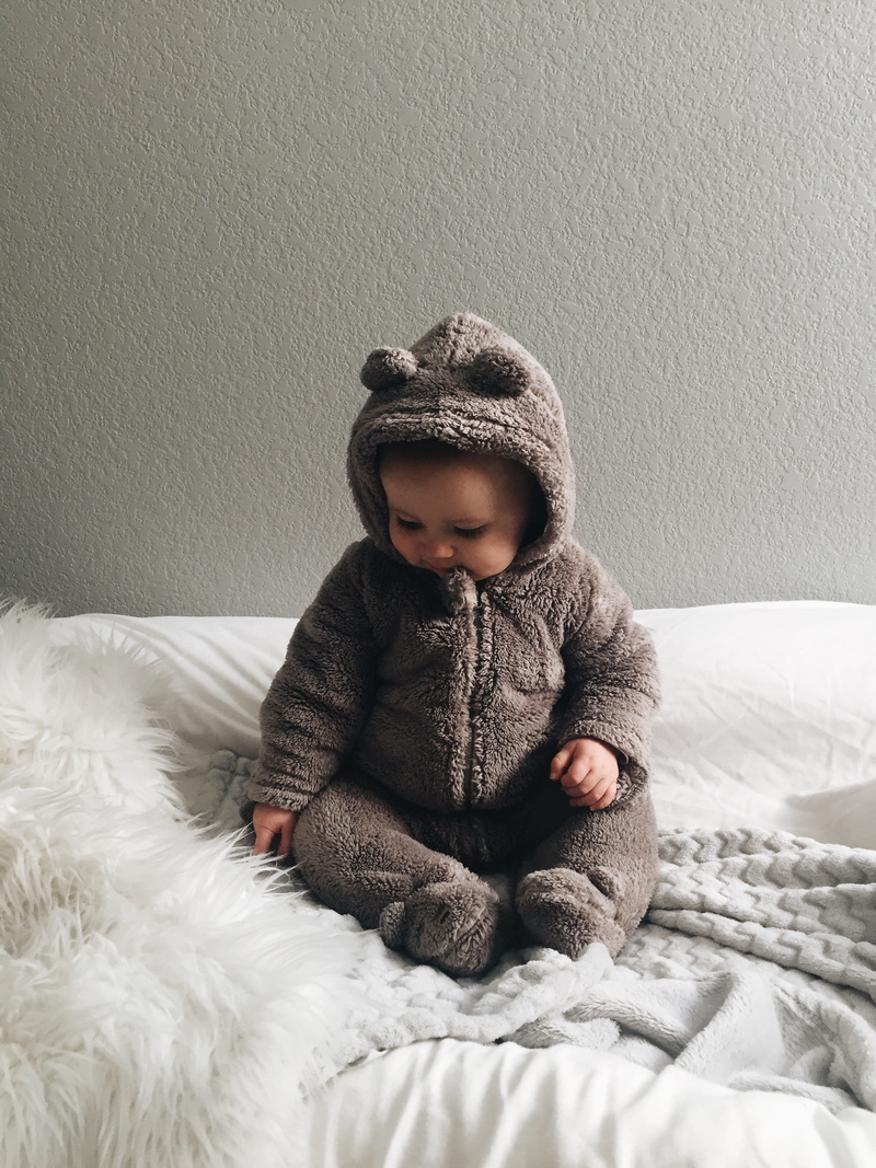 clothing, textile, fragile, bed, wearing, lifestyles, seating, winter, childhood, looking, 2K, gray, indoors, baby, toddler, real people, looking away