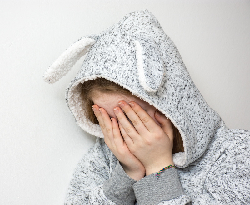 winter, young, childhood, embarrassment, mourning, women, depression, covering, hands covering eyes, tormented, violent, hood, indoors, girl, human face