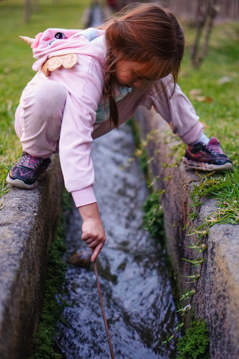 wall, leisure activity, lifestyles, white, one person, wearing, girls, outdoors, rock, rock - object, girl, casual clothing, childhood, real people, females