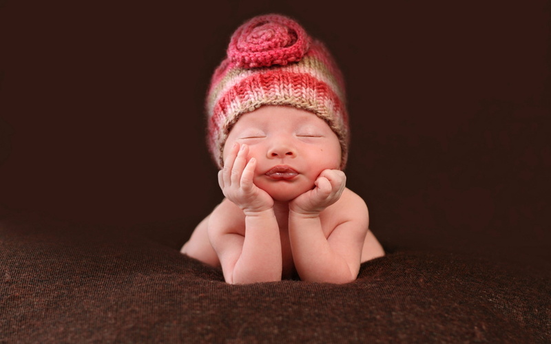 resting, newborn, baby, lifestyle, eyes, hat, lying Down, studio Shot, cute, black background, sadness, new Life, indoors, front view, lifestyles, looking