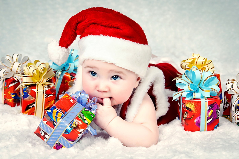 indoors, joy, happiness, humor, small, cheerful, gifts, 2K, new Year, smiling, boys, child, young, toys, cap, season, fun, december, people, front view