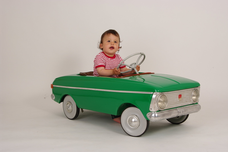 casual clothing, portrait, green, 4K, studio shot, retro styled, caucasian Ethnicity, baby, full length, small, indoors, green cab, transportation, ride