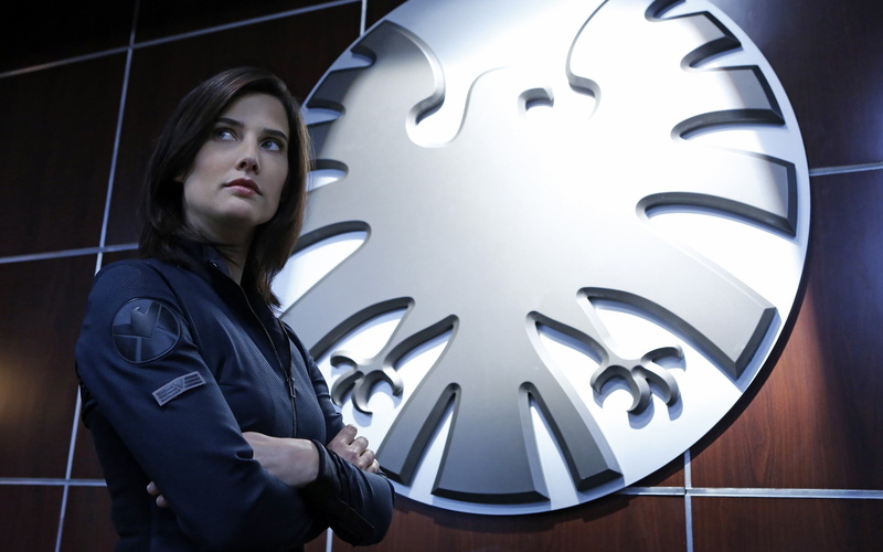 teenager, leisure activity, illuminated, Cobie Smulders, contemplation, wall - building feature, young adult, 2K, standing, waist up, indoors, Marvel Comics