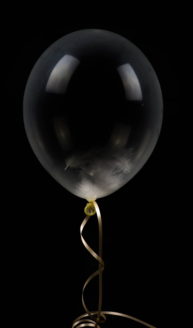 realistic, golden, helium, white, vulnerability, ribbon, cut out, indoors, helium balloon, studio shot, black background, balloon, no people, color, anniversary