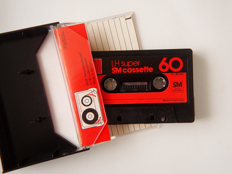 studio shot, play music, music cassette, analog, magnetband, recording, text, wall - building feature, accidents and disasters, western script, communication