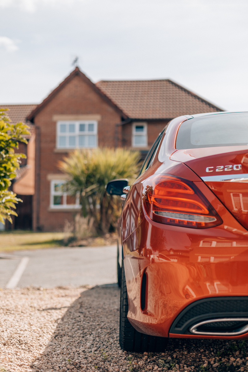 nature, residential district, transportation, sports car, potted plant, focus on foreground, taillight, suburbia, vase, c, vehicle, garage, 5K, road, no people