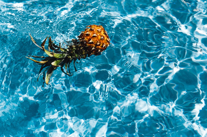 above, pineapples, tropical fruit, rippled, copyspace, high angle view, swimming pool, sunlight, day, pool, summer, pineapple, waterfront, nature, fruits