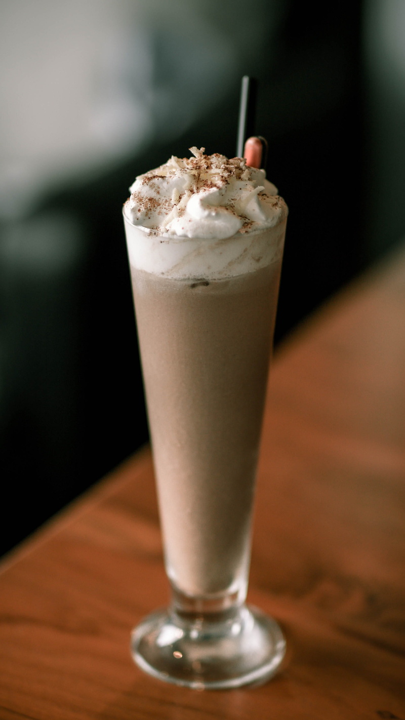 cake, milkshake, single object, coffee, cocktail, food and drink, still life, icing, drink, beverage, refreshment, glass, confectionery, sweets, alcohol
