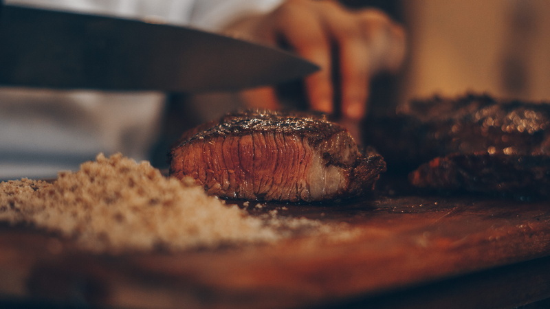 freshness, food and drink, vegetable, snack, pastry, table, bacon, plant, person, baked, one person, indoors, human hand, bbq, human, food, seasoning, ribs