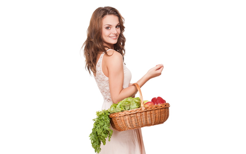 apples, vegetables, brown hair, is, basket, keeps, girl, 5K, white background, cabbage, fruit, beautiful, parsley, greens, smiling, dress, pepper, in white