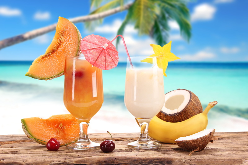 slice, orange color, sand, carambola, yellow, drinking Glass, table, alcohol, orange - Fruit, cherry, citrus Fruit, no people, garnish, banana, tropical Climate