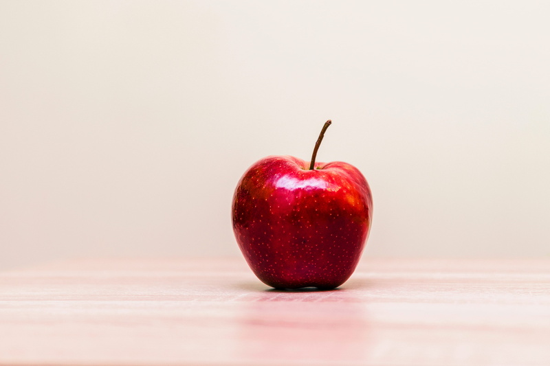 apple - Fruit, plant stem, close-up, single object, indoors, simplicity, simple, wellbeing, copy space, colored background, no People, fruit, healthy Eating