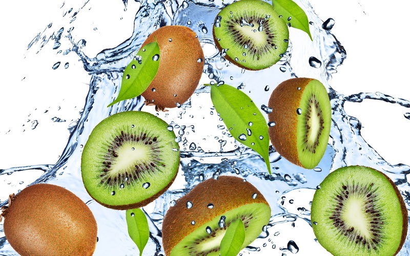 kiwi - Fruit, green Color, fruit, liquid, juice, seed, splashing, high angle view, slice, isolated, apple - Fruit, green, cross section, white background