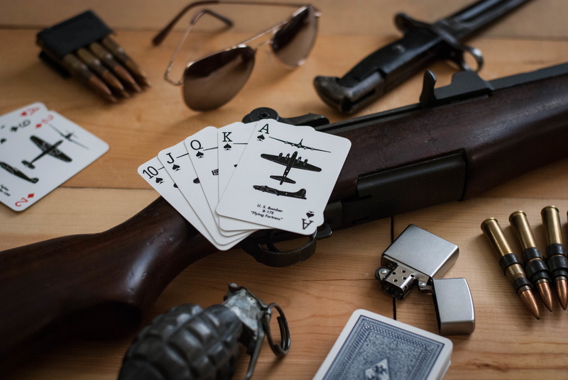 choice, gun, no people, group of objects, text, wood - material, paper, collection, table, weapon, large group of objects, social issues, pineapple, craft