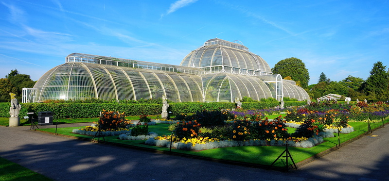built structure, outdoors, tourism, sky, blue, building exterior, flowerbed, travel destinations, beauty in nature, ornamental garden, garden, palm, house