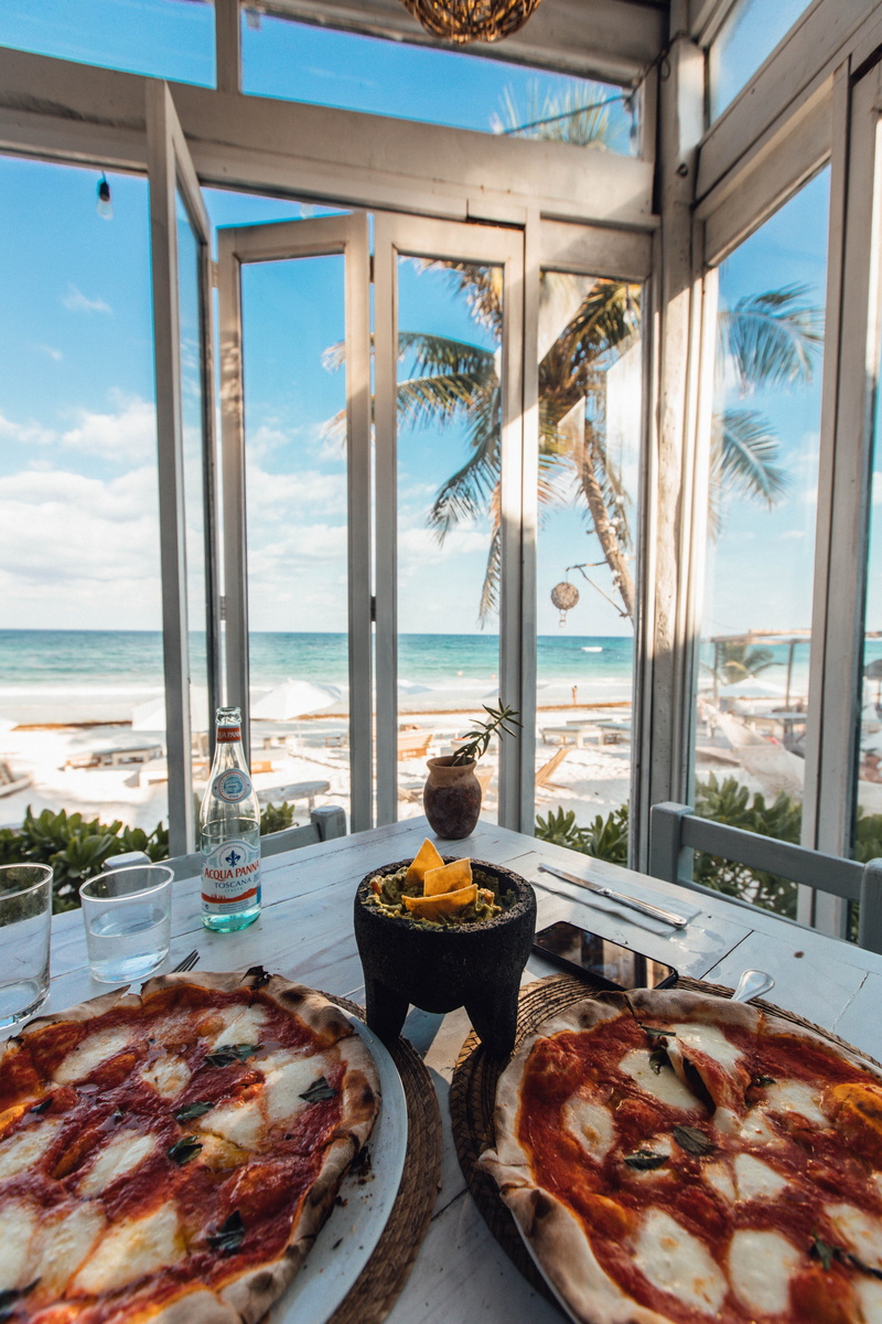 pizza, tulum, potted plant, dinner, still life, people, lunch, ocean, plant, flora, beachy, nachos, plate, indoors, mexico, chip, drink, jar, sky, snack