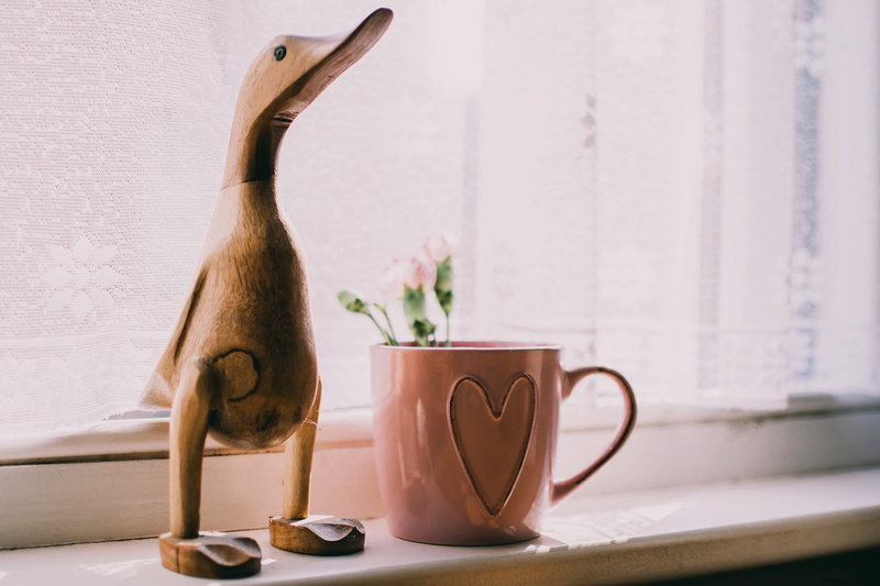 ornaments, home interior, pottery, coffee cup, tableware, ceramics, crockery, domestic room, table, close-up, near, wooden, animal representation, mammal