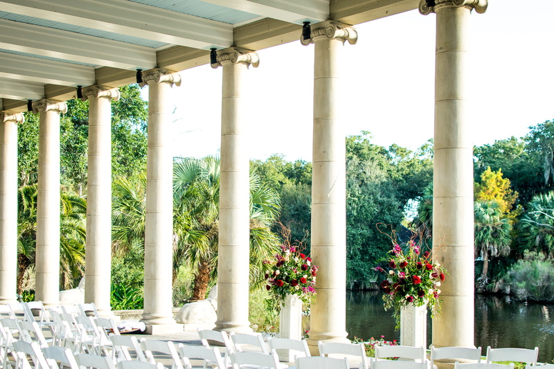 venue, daytime, table setting, river, in a row, architecture, tree, flowering plant, colonnade, built structure, architectural column, formal garden, dining