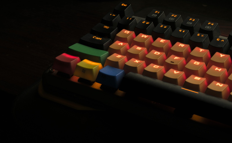 multi colored, arts culture and entertainment, dark, studio shot, still life, green, black, indoors, keyboard, illuminated, black background, relaxation